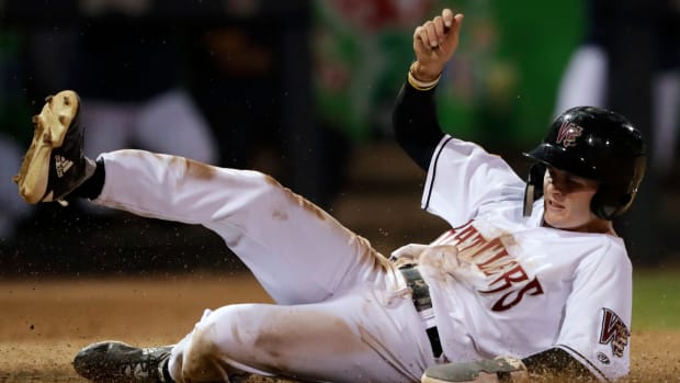 SF Giants prospect Hayden Cantrelle slides into home plate during his time with the Wisconsin Timber Rattlers.